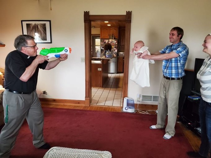 Coronavirus: Priests observe social distancing by baptizing babies with toy water pistols! See pictures