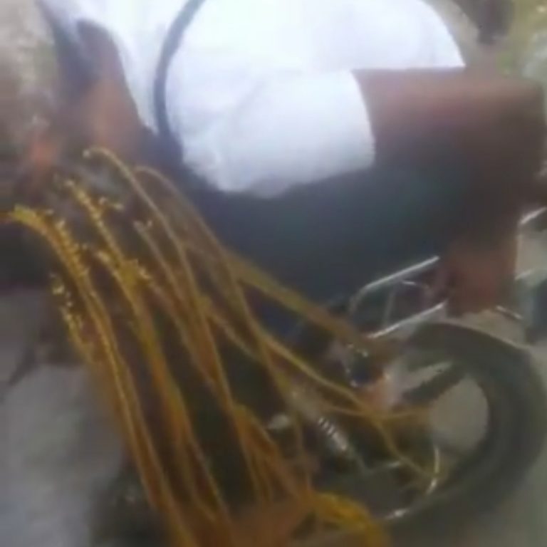 See embarrassing moment when lady’s “1 million braids” hair get stuck in Okada wheel (video)