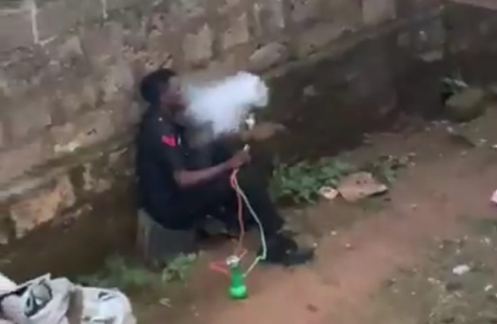 Caught in the Act: Nigerian Police officer seen smoking “Shisha” profusely! (Video)