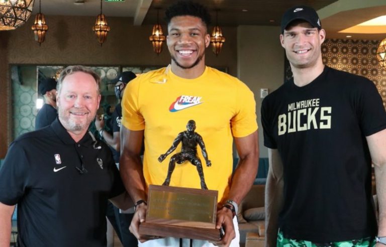 NBA star of Nigerian descent, Giannis Antetokounmpo shows-off his Defensive Player of the Year Award! Pictures 👇