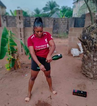 I wont use water again! Nigerian lady brags as she brushes her teeth with N25,000 Remy Martin Vsop! Pictures 👇
