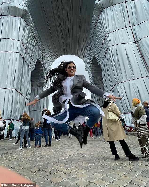 Demi Moore joyfully jumps into the air during ‘photoshoot’ in front of L’Arc de Triomphe