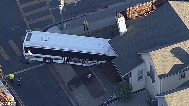 Bus smashes into Oakland home after being hit by a stolen car which was fleeing from police 1