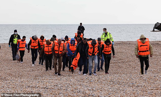 Dozens of migrants land on beach in Kent escorted by the RNLI days after 1,568 crossed the Channel 1