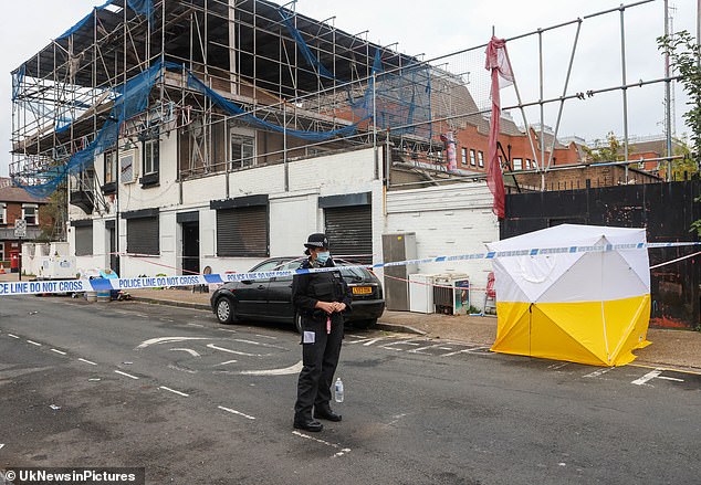 Builders discover 'badly decomposed' body in derelict pub next door to an East End police station 1