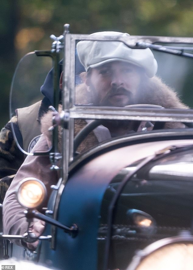 Jason Momoa checks out the sights of London in style in a 1952 Bentley convertible