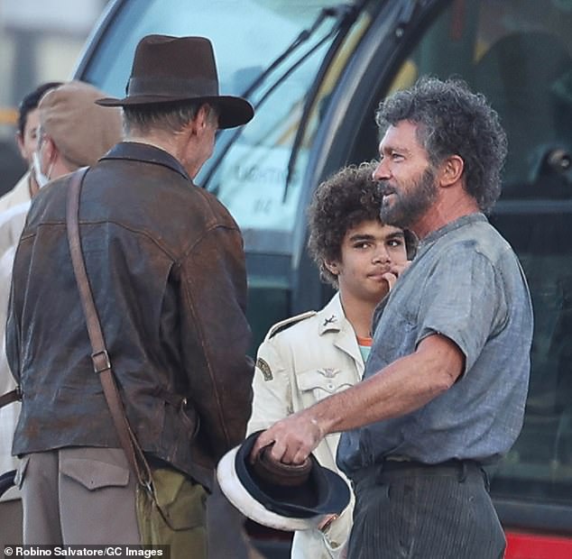 Harrison Ford greets Antonio Banderas with a bear hug on the seaside Sicily set of Indiana Jones 5