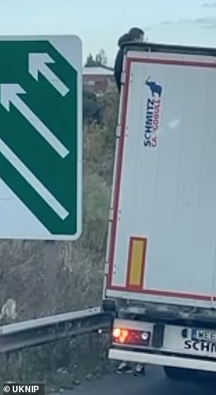 Moment 'migrants' climb out of parked lorry in traffic jam on A2 in Kent near Dartford Crossing 1