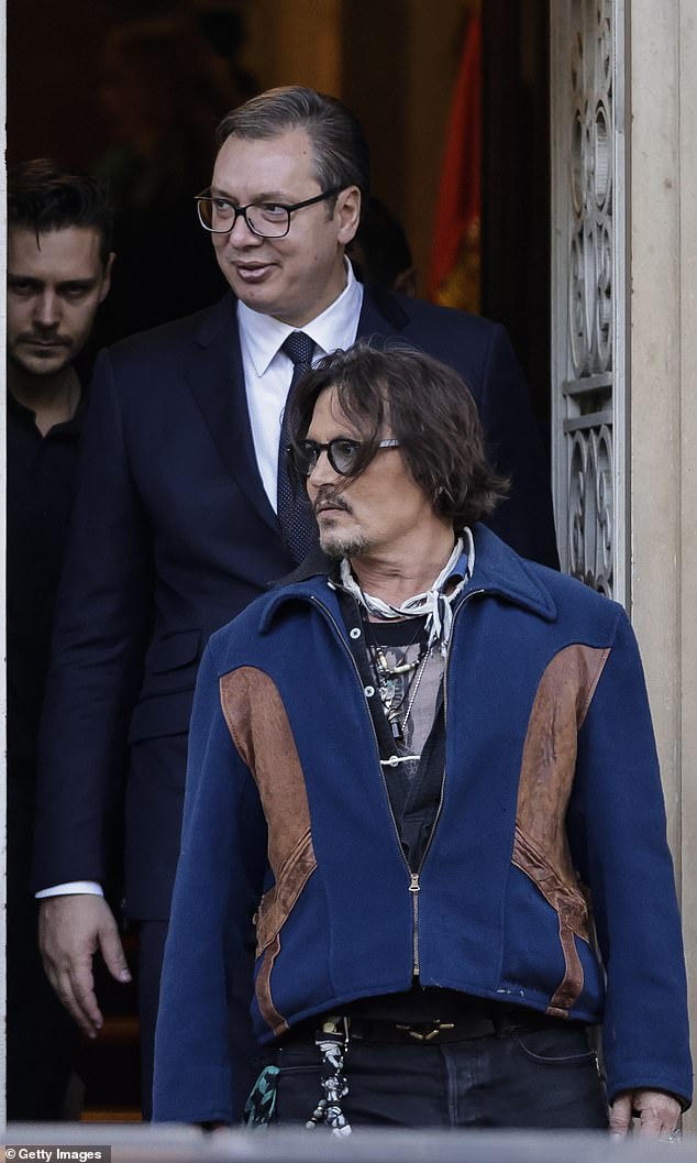 Johnny Depp is mobbed by fans leaving his hotel at the 2021 Rome Film Festival