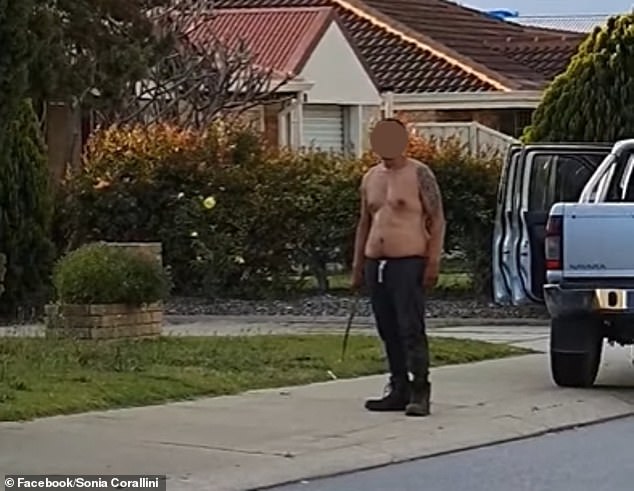 Terrifying moment an angry shirtless man threatens police with a knife during road rage incident 