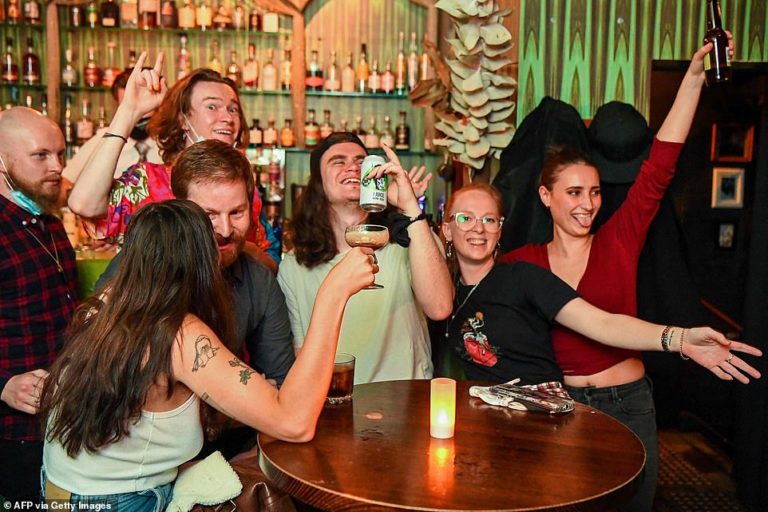 Melbourne celebrates end of Covid lockdown at midnight with pubs, salons, restaurants open