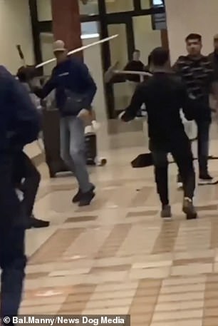 Thugs use MOPS as weapons during a bizarre brawl inside a busy The Trafford Centre