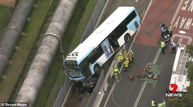 Driver trapped UNDERNEATH a bus dies after horror collision 