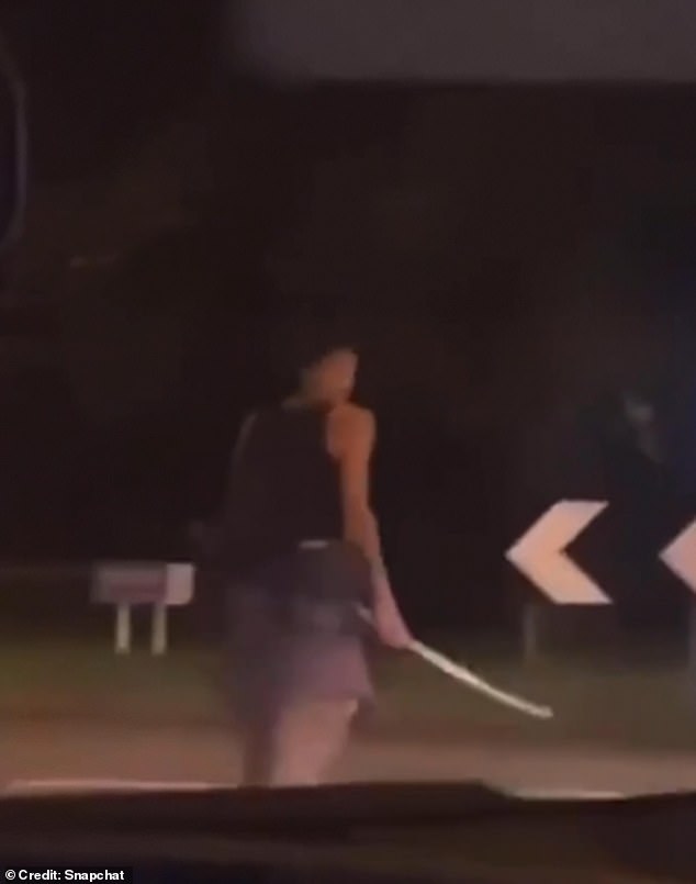 Samurai sword thug faces down police and motorists after ‘attacking two men in attempted murder bid’