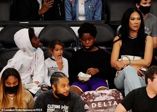 Kimora Lee Simmons enjoys family night as she watches LA Lakers game with her boys