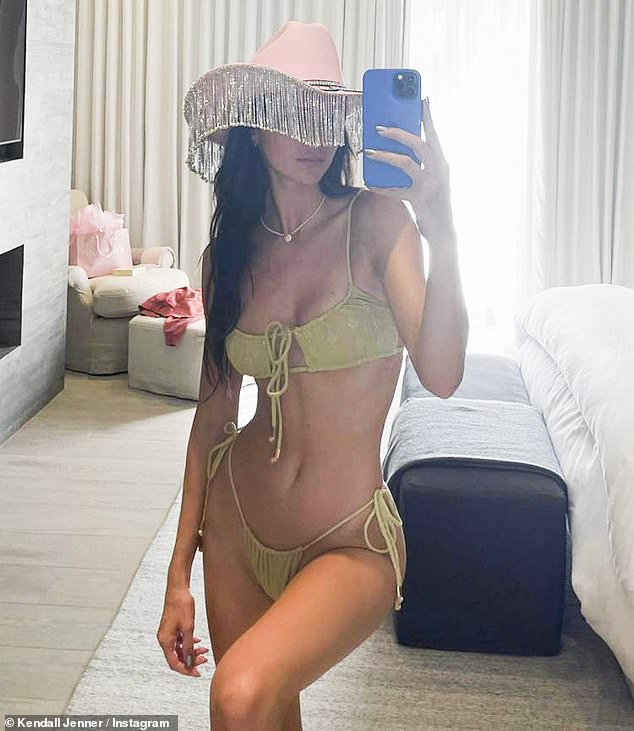 Kendall Jenner shows off her 24in waistline in a skimpy bikini as she adds cowgirl hat with initials