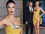 Adriana Lima shows model legs in mini dress with Andre Lemmers at Last Night In Soho premiere in LA