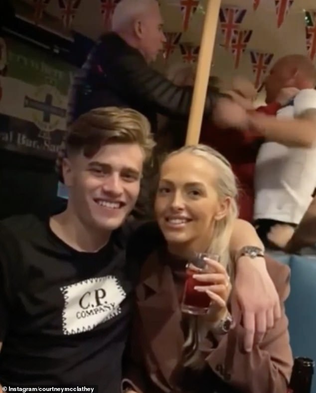 Couple are photobombed by pub brawlers as they pose for a picture [Video]