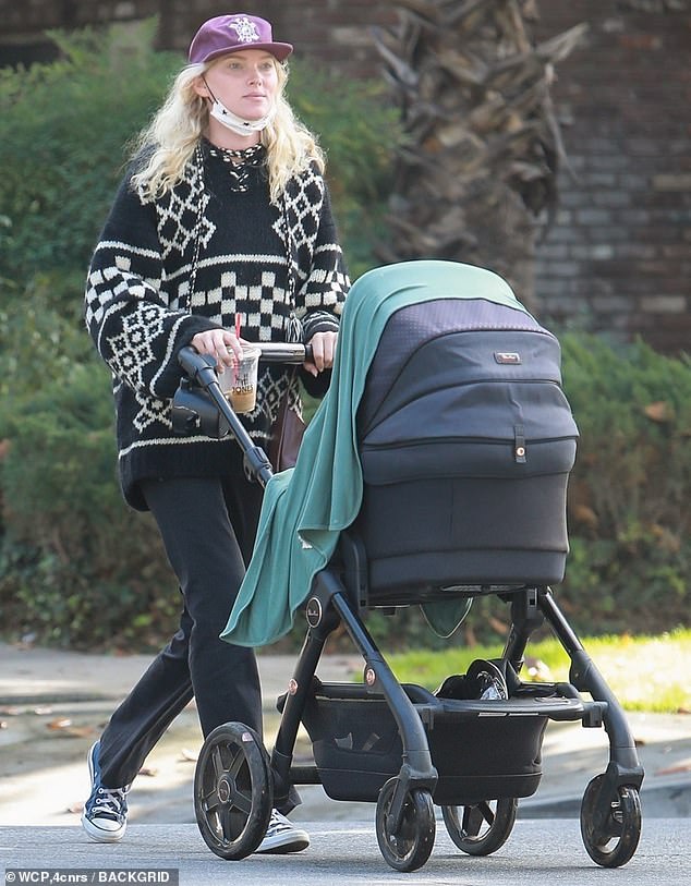 Elsa Hosk cozies up to take baby daughter Tuulikki for a stroll in Pasadena