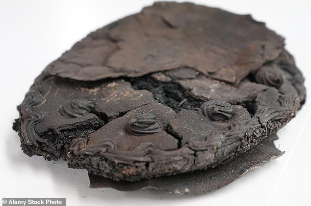 ‘Heavily charred and blackened’ nut cake baked during World War II found preserved in German town