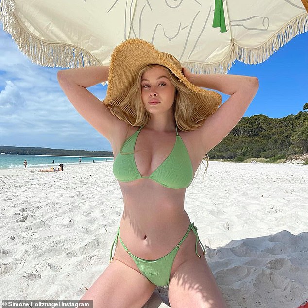 Simone Holtznagel shows off her sensational curves and ample cleavage in a mint green string bikini