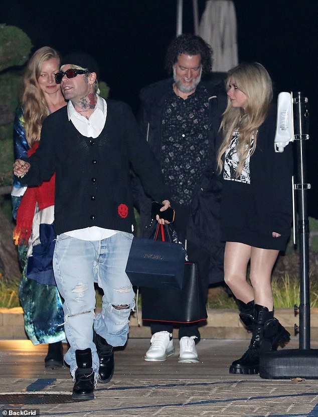 Avril Lavigne puts on a leggy display in oversized black hoodie on date with boyfriend Mod Sun