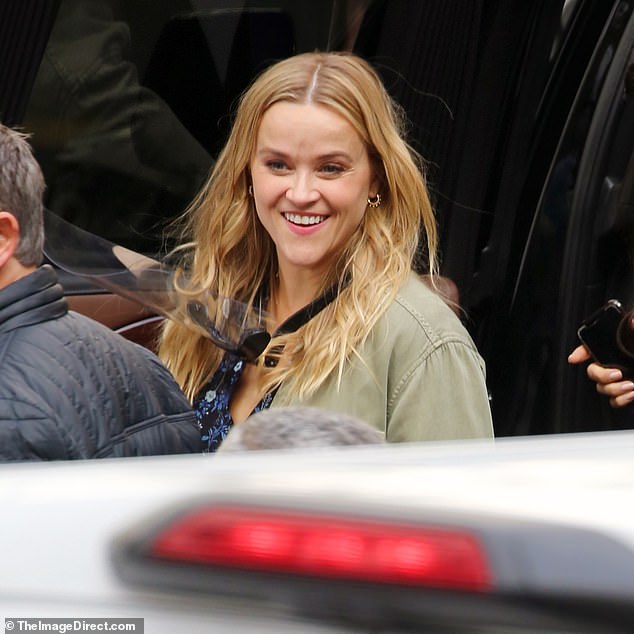 Reese Witherspoon beams ear-to-ear in a denim skirt as she films Your Place Or Mine