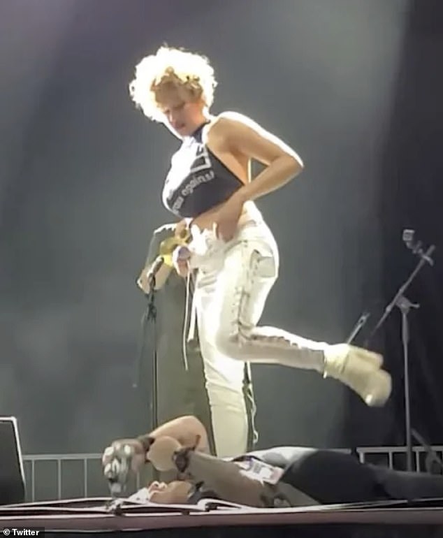 Rock group frontwoman Sophia Urista URINATES on a fan’s face on stage in front of shocked audience