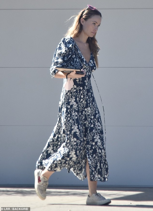 Olivia Wilde models plunging floral dress and sneakers while running errands in LA