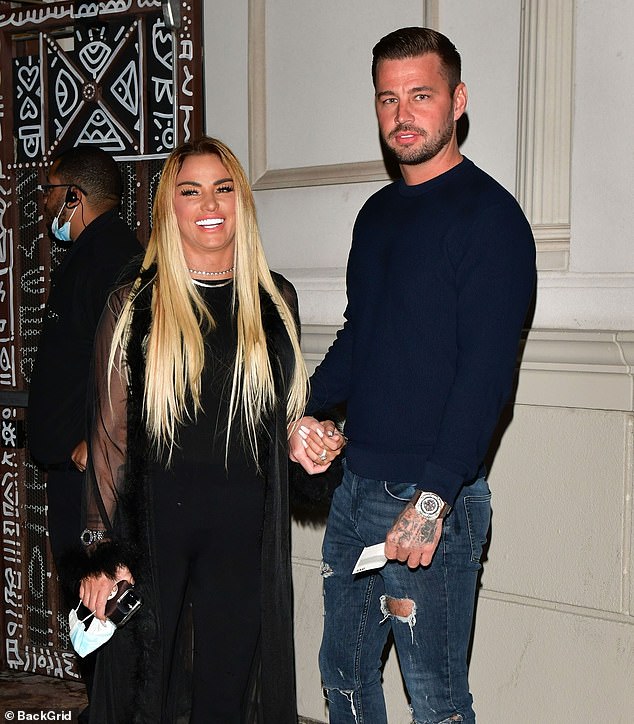 Katie Price cannot stop beaming as she holds hands with fiancé Carl Woods on Vegas night out