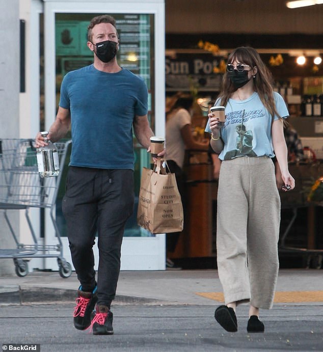 Dakota Johnson and Chris Martin keep it casual while stepping out on a grocery run in Los Angeles