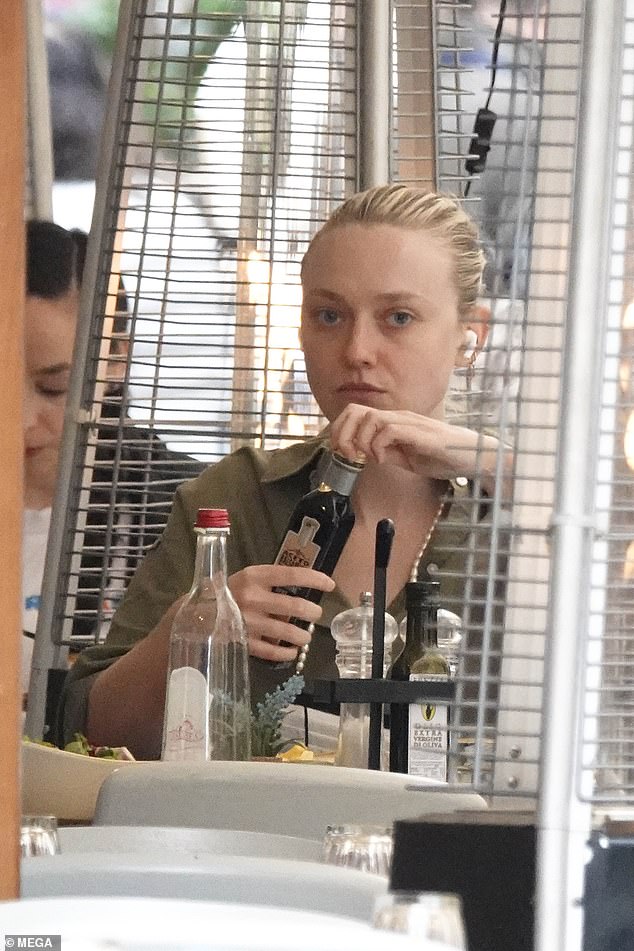 Dakota Fanning looks chic as she enjoys lunch alone in Rome