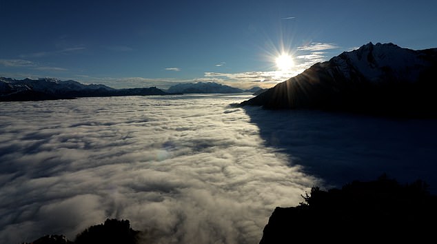 Clouds swirl like the ocean waves in time-lapse video filmed high in the Swiss Alps [Video]