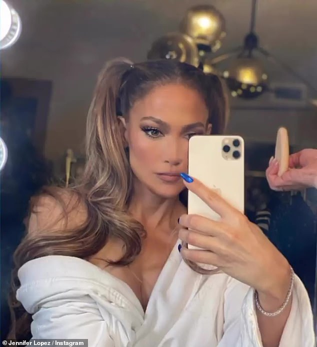 Jennifer Lopez gets all glammed up for the 2021 Rock And Roll Hall Of Fame in white robe