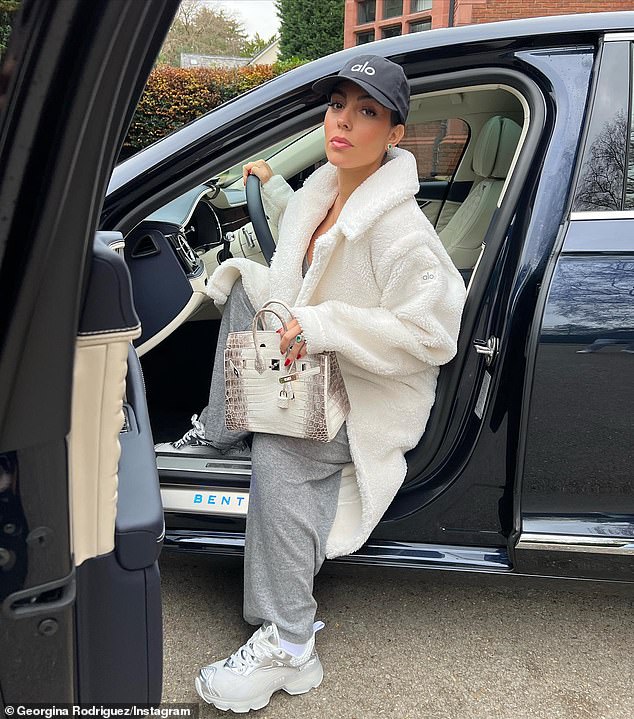 Pregnant Georgina Rodriguez poses next to her Bentley in a winter-ready white fluffy coat