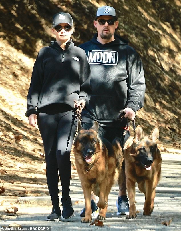 Nicole Richie and Joel Madden sport matching looks as they take their dogs for a walk in Los Angeles