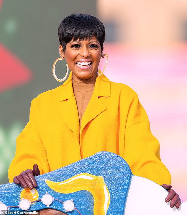 Tamron Hall rocks a colorful yellow look at the Dunkin’ Donuts Thanksgiving Day Parade