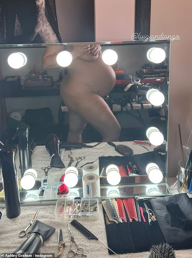 Ashley Graham showcases her bare baby bump in mirror snap 