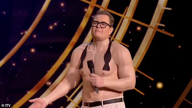 Alan Carr sports a prosthetic six-pack while hosting the Royal Variety Show 
