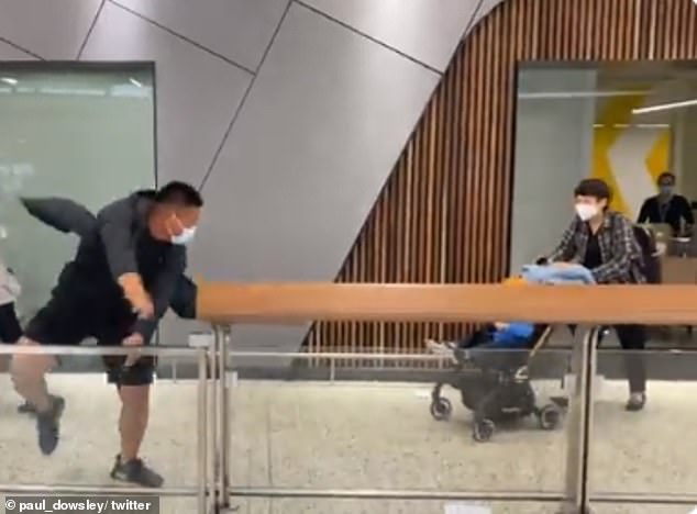 The adorable moment father jumps the barrier at the airport to meet his 18-month-old baby