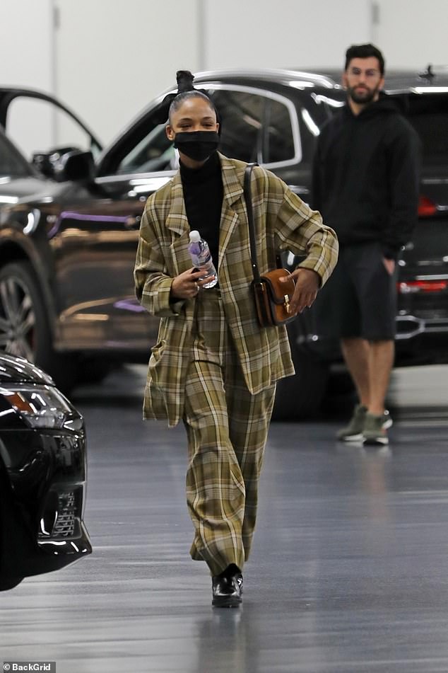 Tessa Thompson makes a bold fashion statement in a plaid suit at an Audi dealership