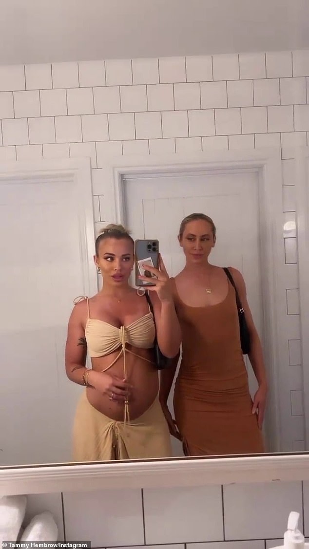 Tammy Hembrow proudly shows off her growing baby bump as she poses for a bathroom selfie