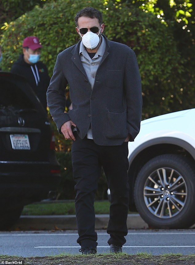 Ben Affleck masks up while rocking a blazer for a stroll around the neighborhood