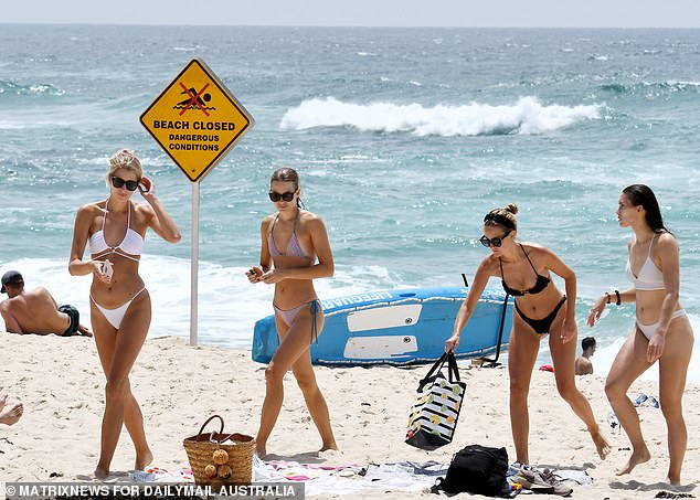 Weather Sydney: Thousands pack beaches despite mounting Covid cases as temperatures soar to 38C
