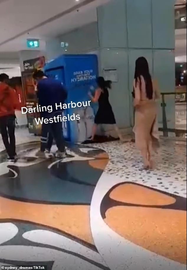 Sydney Woman bashes vending machine in a Westfield after escalator ruins her expensive high heels