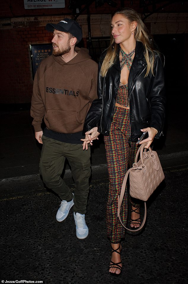 Zara McDermott flaunts her toned abs in a tweed co-ord with beau Sam Thompson