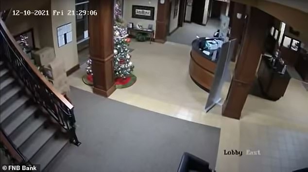 Moment tornado tears through a bank in Kentucky last weekend, ripping up Christmas decorations