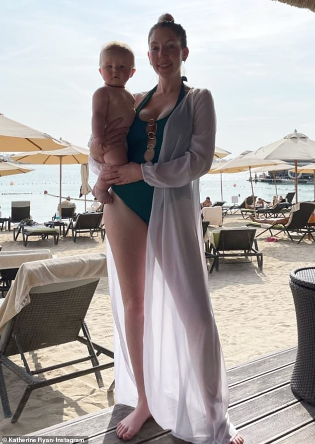 Katherine Ryan stuns in an emerald green swimsuit with her family enjoying a winter break