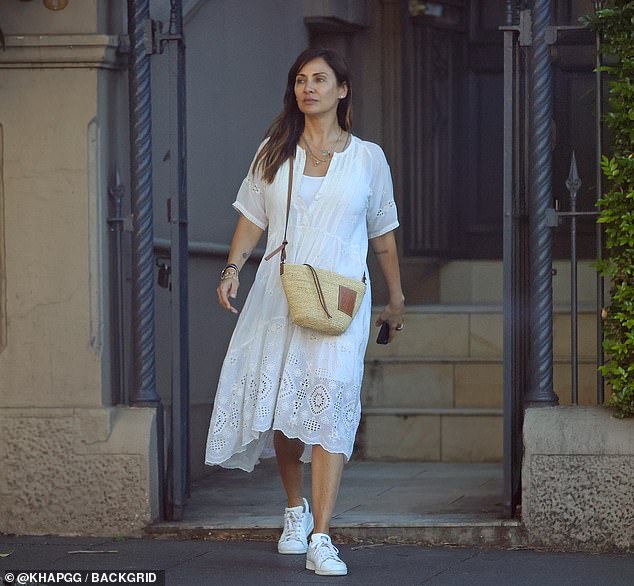 Natalie Imbruglia stuns in a white summer dress as she meets up with friends in Sydney