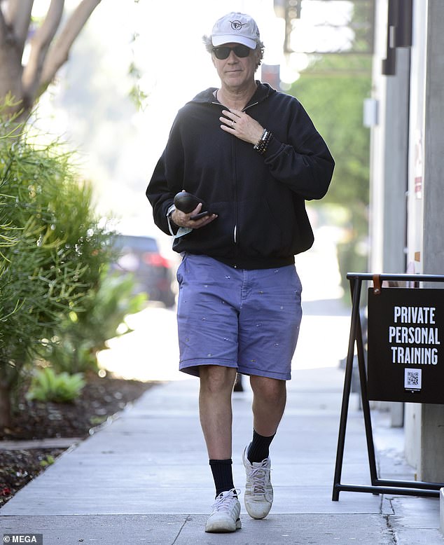 Will Ferrell places a call as he steps out for coffee 1